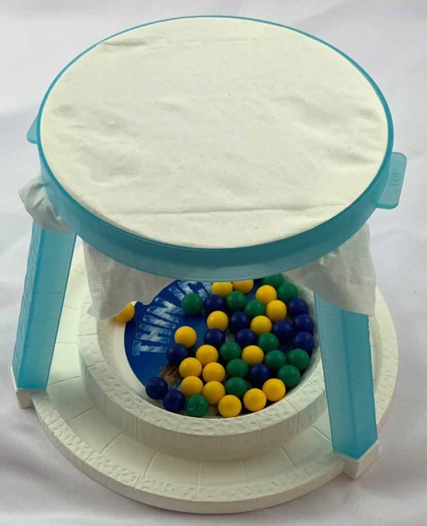 Game with tissue sales paper and marbles